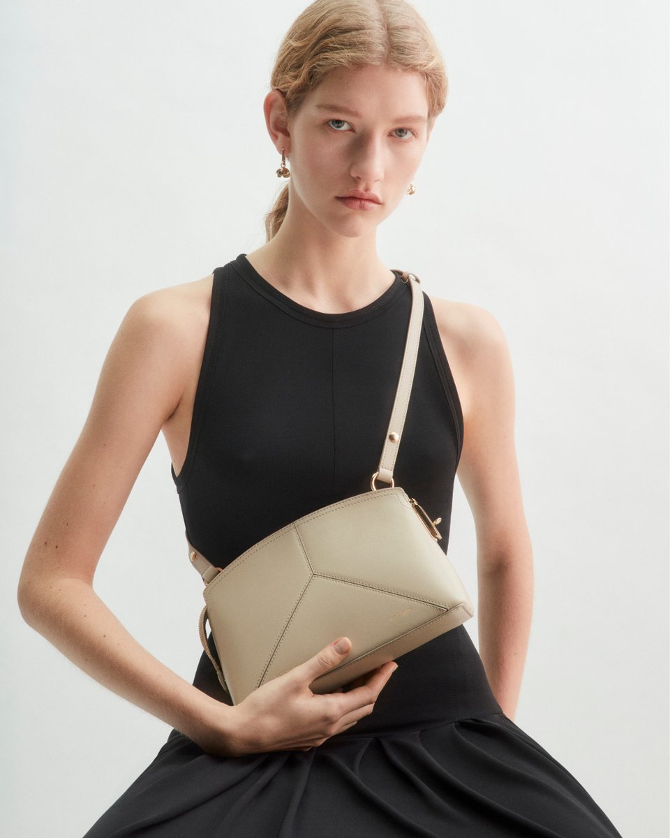 Style, to go. The Victoria Clutch in Taupe, now with an adjustable crossbody strap for added ease. Available now >> victoriabeckham.visitlink.me/zGstMt #VBPAW24