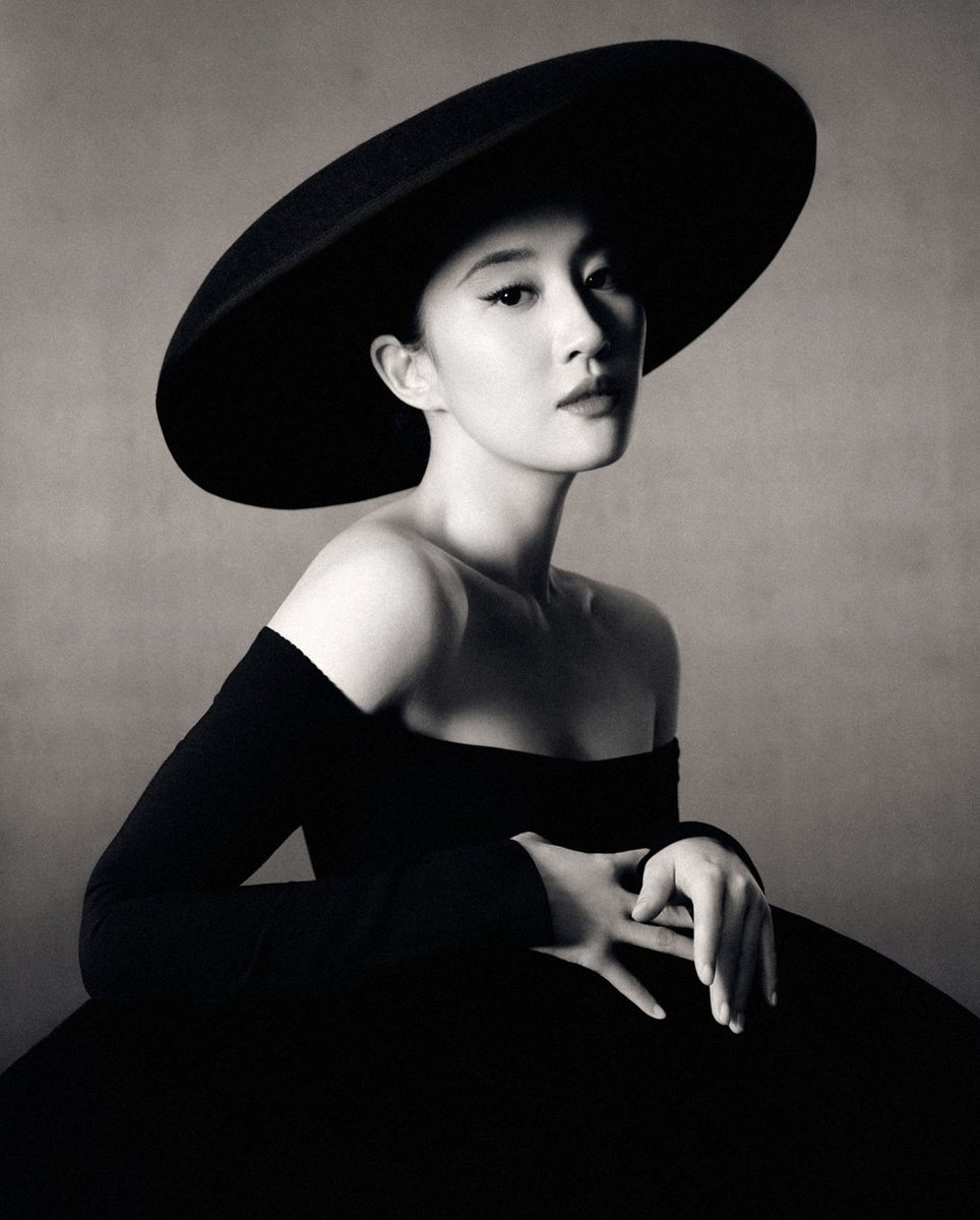 An Elegant Affair: @yifei_cc is featured in the April issue of Harper's BAZAAR China wearing the Off Shoulder Pleated Tulle Dress from the Carolina Herrera Fall Winter 2024 collection designed by @wesgordon. Photographed by Wang Ziqian and styled by Wang Gugu.
