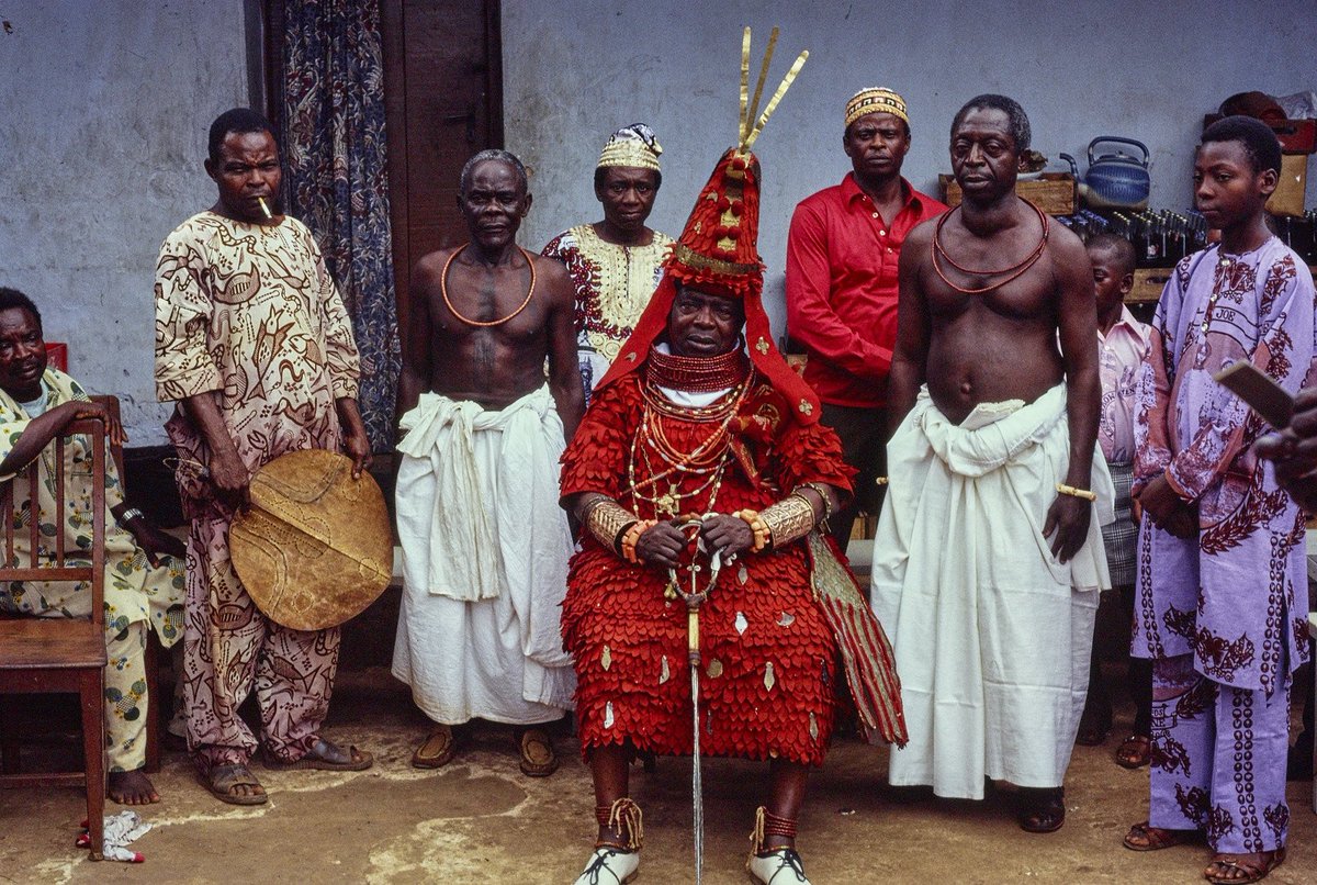 Chief Izevbizua Iyamu, the Esogban of Benin, one of the four Town Chiefs, wearing ehaengbehia attire.( 𝐓𝐡𝐞 𝐩𝐚𝐧𝐠𝐨𝐥𝐢𝐧 𝐀𝐭𝐭𝐢𝐫𝐞)  Benin City.

Photo Credit: Barbara Blackmun Collection/ National Museum of African Art

Circa: December, 1981.