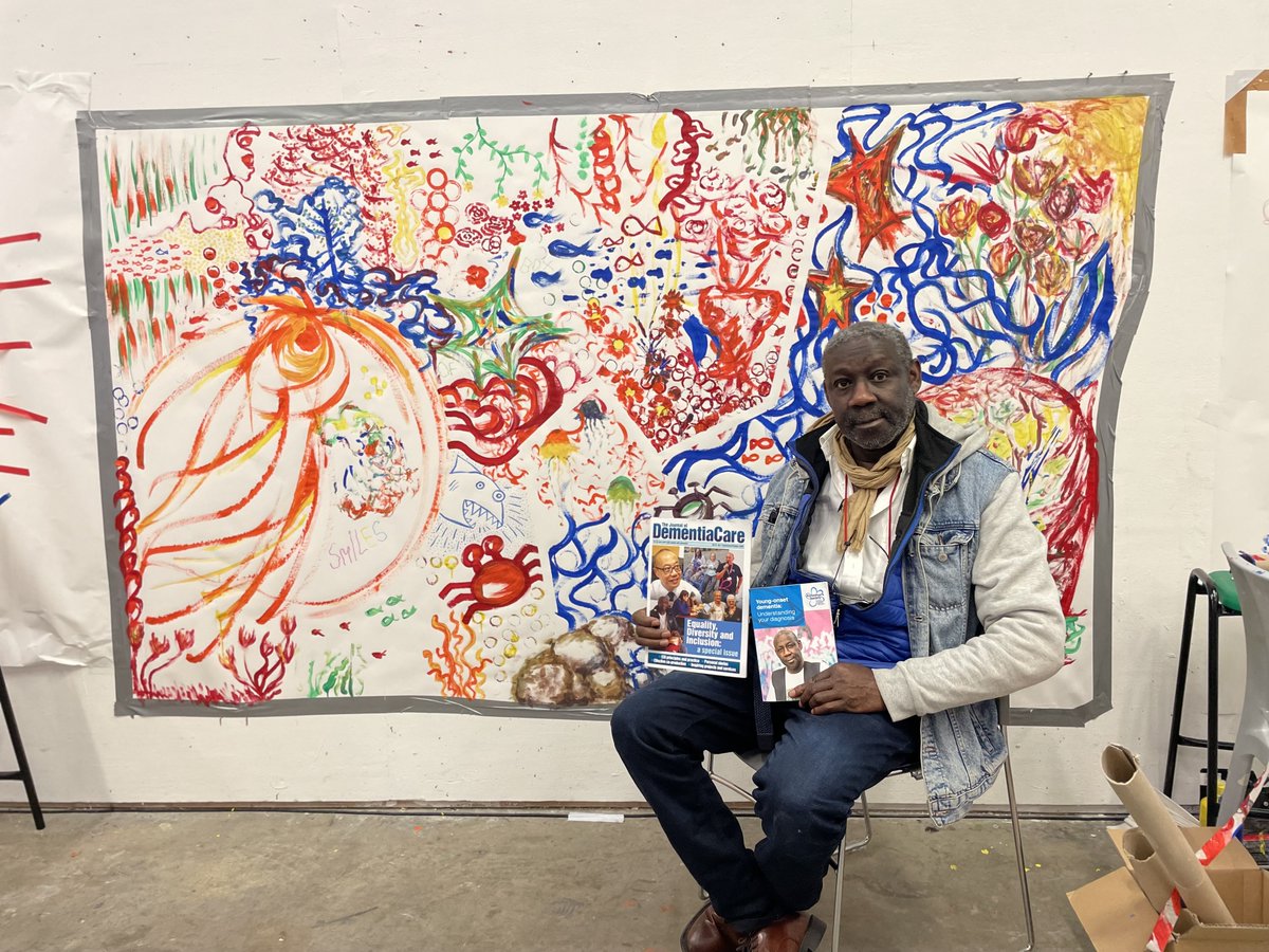 Our brilliant Trustee & @alzheimerssoc Ambassador @ronaldamanze does an incredible job championing the importance of the arts as a therapeutic outlet for people affected by dementia. This painting behind him was created by our participants at @csm_news on our latest programme