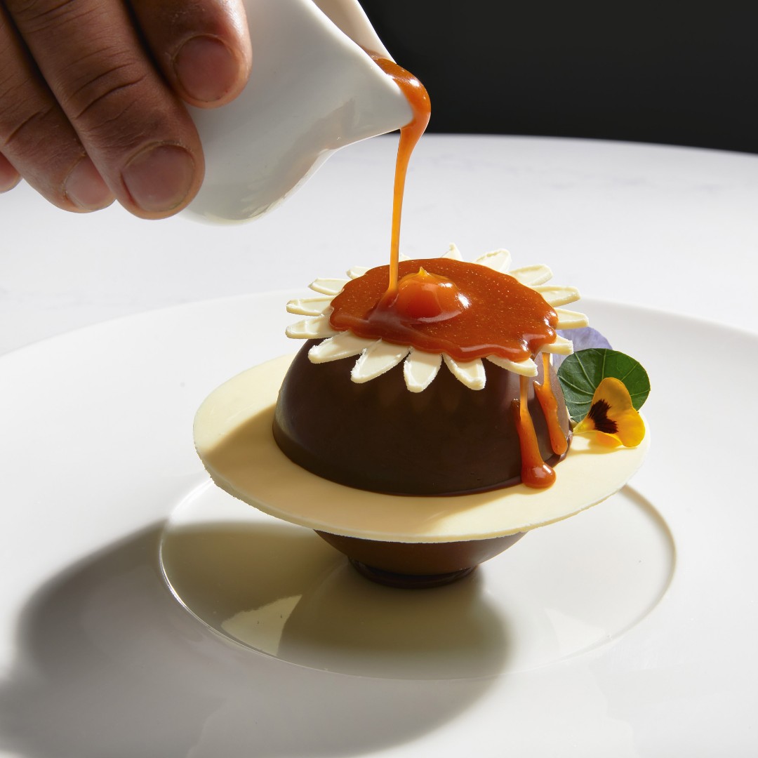 Step into a world of culinary bliss with a melted milk chocolate sphere, where each creamy, melting bite captivates your senses 🤤 #TheKClub #TimeToPlay #ThePreferredLife