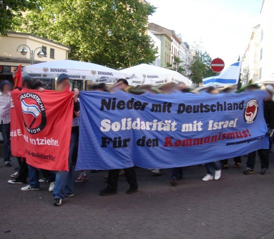 “Down with Germany. Solidarity with Israel. For Communism!” Interesting…