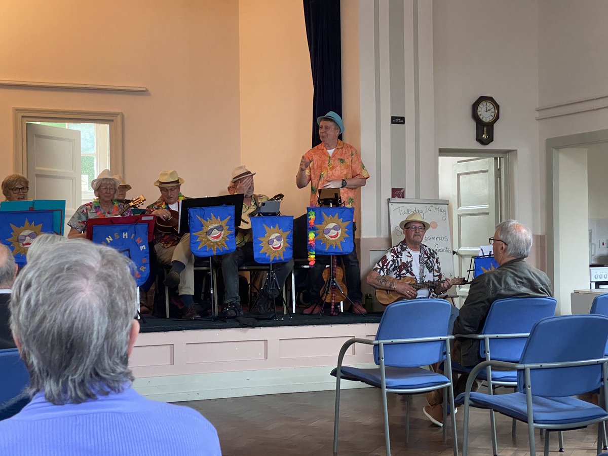 Enjoying some live music from the Sunshine Strummers .