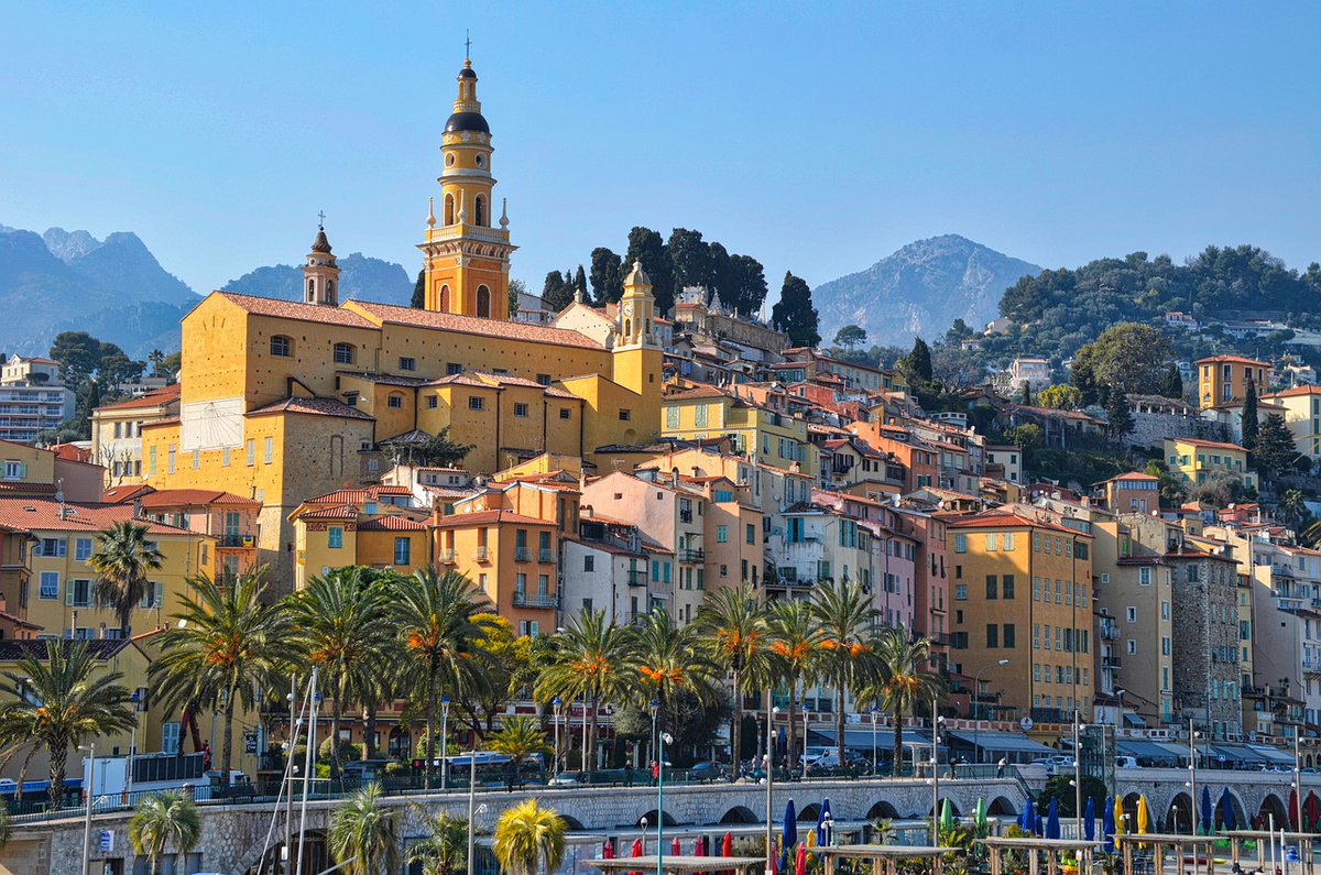 Menton, where pastel hues meet azure waters! 💙 Stroll along the Promenade du Soleil, savor local seafood at beachside cafés, and lose yourself in the narrow alleys of the Vieille Ville. This slice of paradise awaits your discovery. 🇫🇷🌟 #ExploreFrance