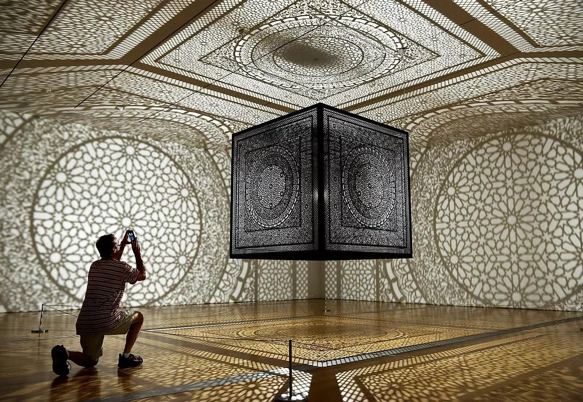 Artist Anila Quayyum Agha brought her immersive light art installation 'Intersections' to the Peabody Essex Museum 2012. This beautiful instillation plays with light and shadow to form intricate patterns through the room & space! #light #design #lightart #shadows