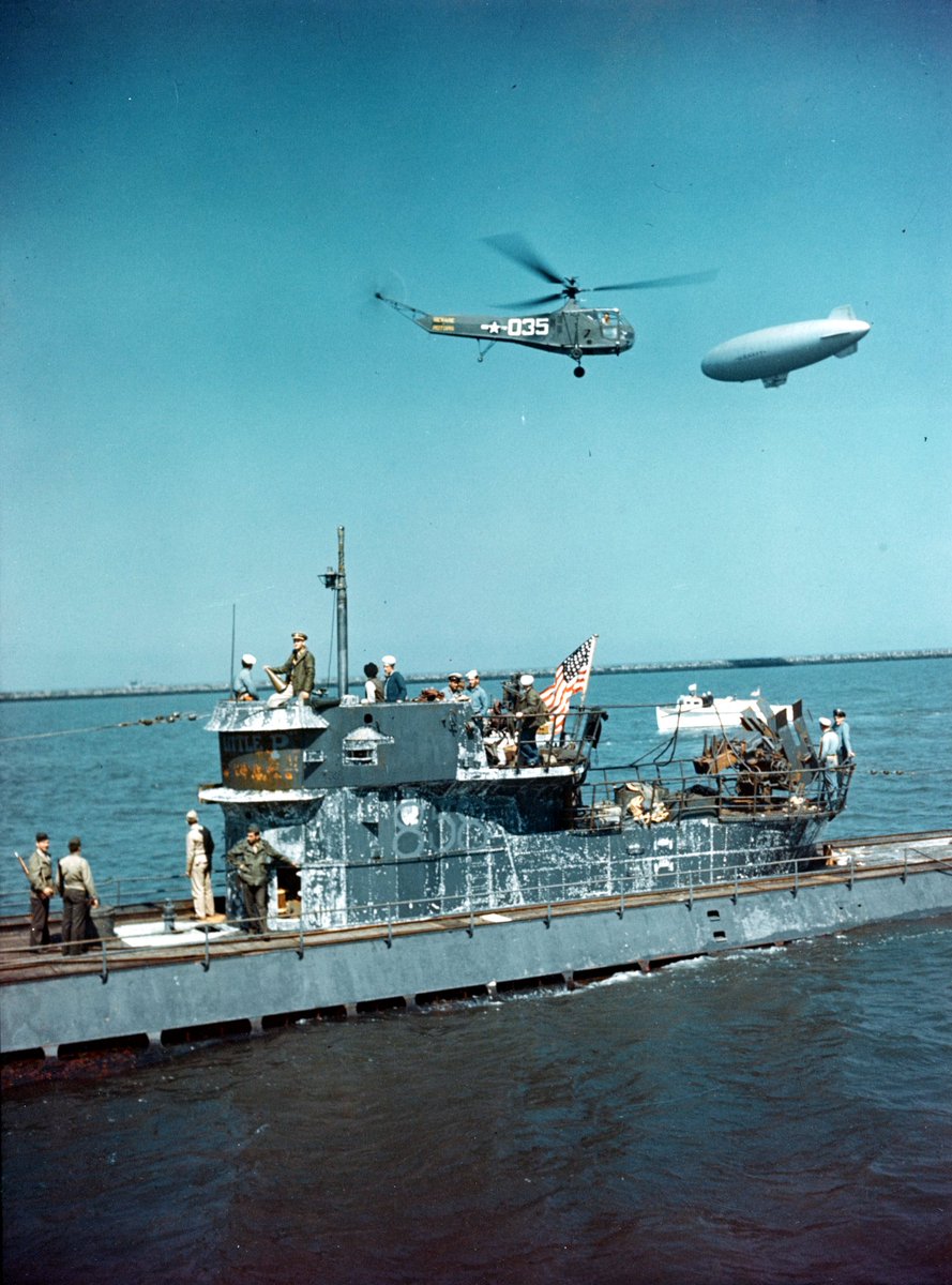 #OTD in 1945, U-858 was taken over by a U.S. Navy crew. The German CO had surrendered the sub at sea four days earlier and was then ordered to proceed to Fort Miles, Delaware. The transfer was watched over by a Sikorsky HNS-I, the first helicopter to enter U.S. military service.