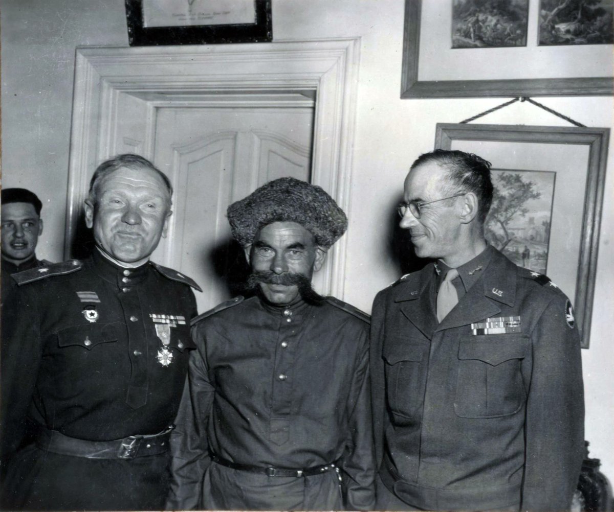 Soviet General Pavel Brikel (left) and American General Alexander Bolling (right) together with the oldest cavalryman of the 3rd Guards Cavalry Corps, May 1945.
