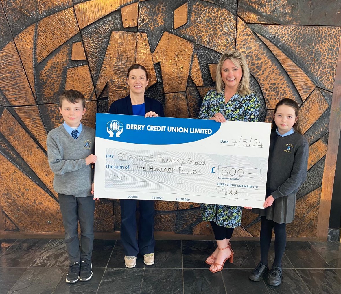 Mrs McNutt, Vice Principal of St Anne’s PS pictured with some of the pupils from the student council and our staff member and past pupil of St Anne’s, Sinead presenting the cheque for a recent project supported by the Donations & Sponsorship Committee.