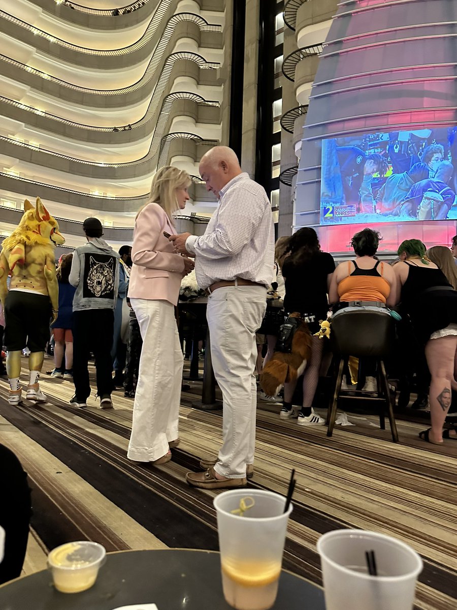 ArcherFoxy's tweet photo. I love the bewildered business travelers horrified by what they are witnessing in the lobby https://t.co/5nEtAgjYBH