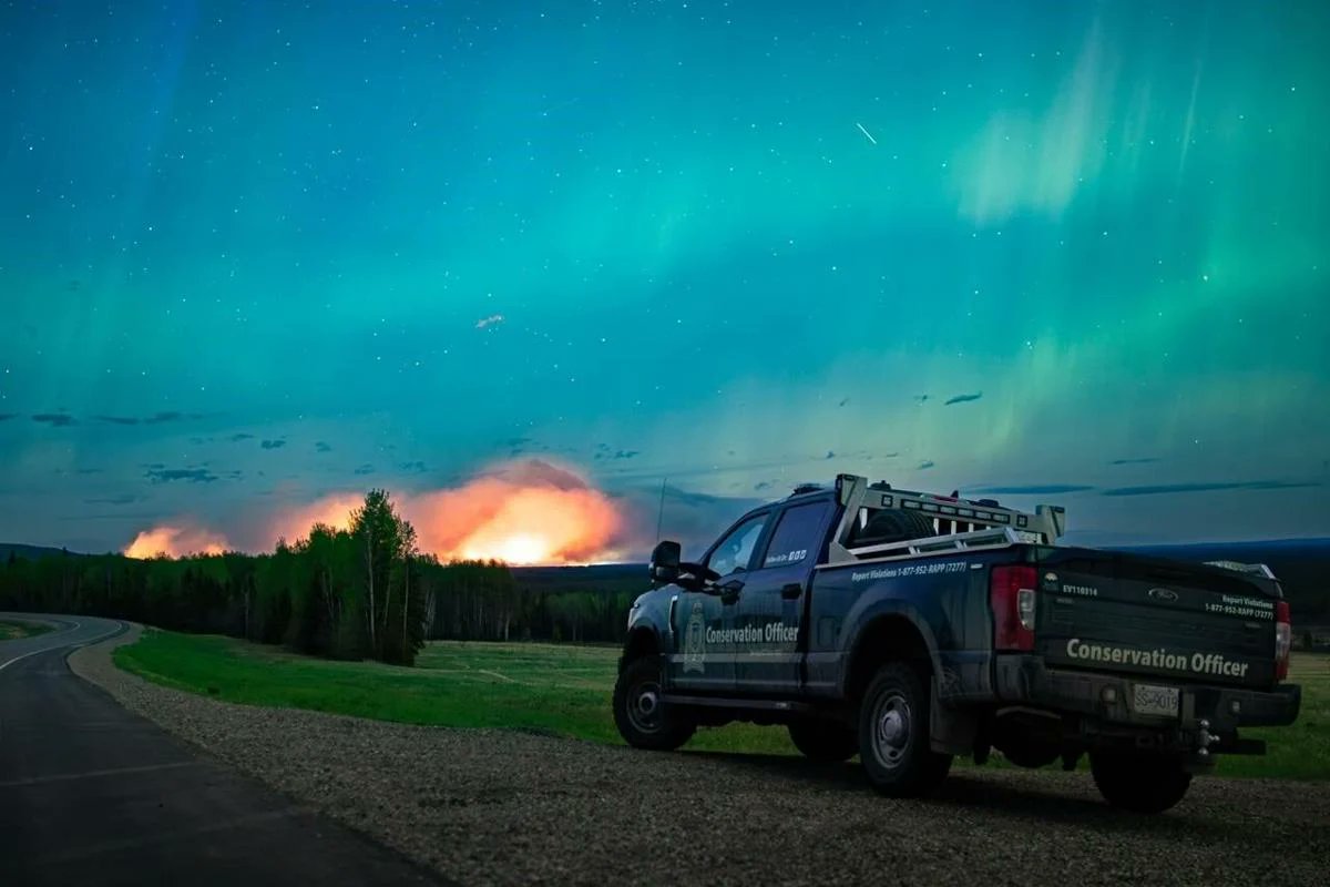 There’s something very eerie about the Fort Nelson wildfires blazing through a night lit up by the aurora borealis. The delicate precision of the Earth’s magnetosphere next to climate-induced fire weather starting far too early in the season. Stay safe, B.C.