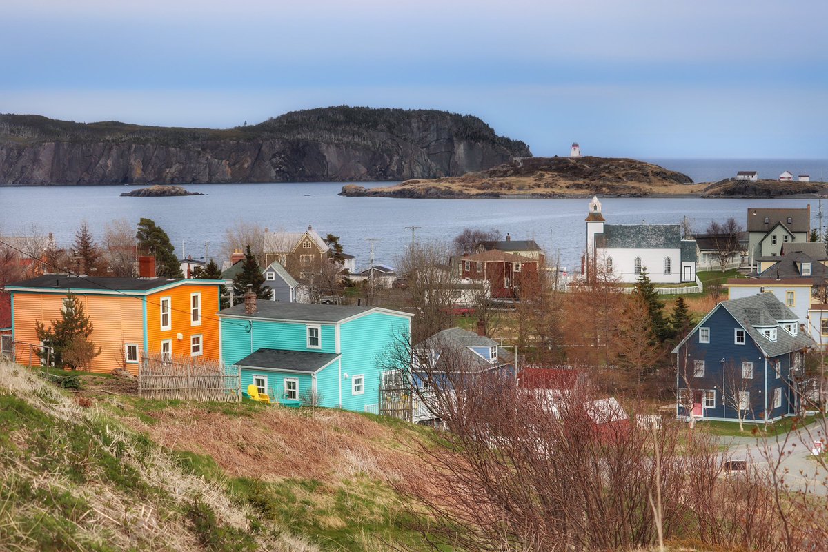 I noticed yesterday when I was visiting Trinity, NL that some of the houses were getting touch ups. It’s so great to see the preservation of these vibrant colours on the homes. In this photo, the orange house is getting some attention. #Newfoundland