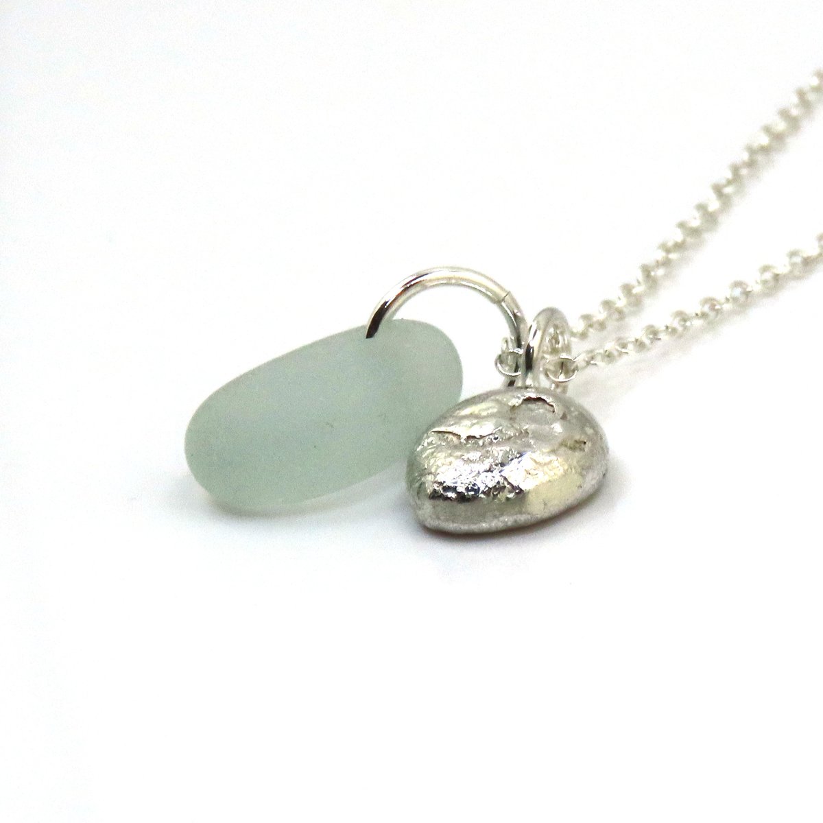 NEW! Seafoam Sea Glass Gem and Recycled Sterling Silver Pebble Necklace thestrandline.co.uk/ourshop/prod_8… #MHHSBD #shopindie #giftideas #seaglass #supportsmallbusiness #craftbizparty #handmadehour #womaninbizhour #sbs #firsttmaster