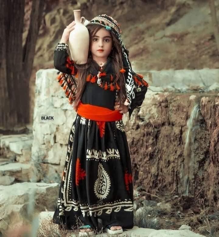 A Kurdish girl in traditional Kurdish clothing
