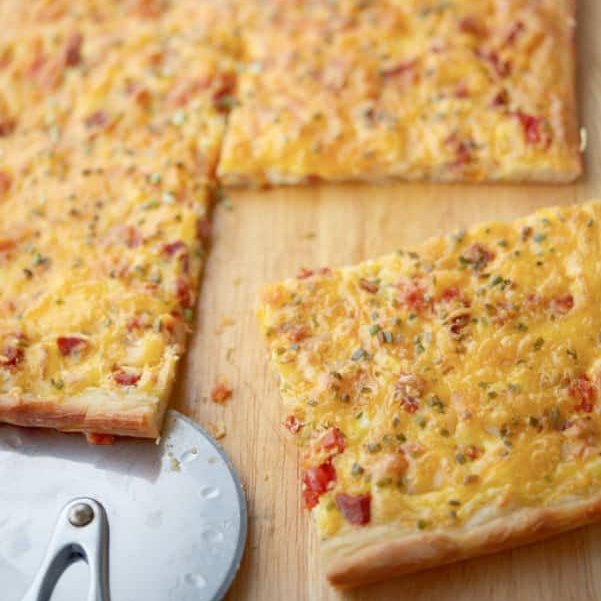 PORTUGUESE BREAKFAST PIZZA Pizza dough topped with Portuguese chourico, potatoes, tomatoes, chives, eggs and Cheddar cheese makes a tasty breakfast. RECIPE--> carriesexperimentalkitchen.com/portuguese-bre… #breakfast #pizza