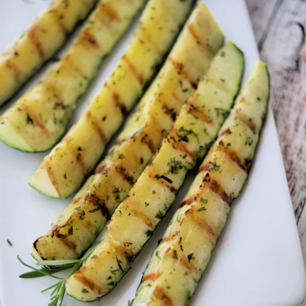 Fresh garden zucchini brushed with fresh rosemary, extra virgin olive oil, Kosher salt and black pepper; then grilled. RECIPE--> carriesexperimentalkitchen.com/grilled-zucchi…