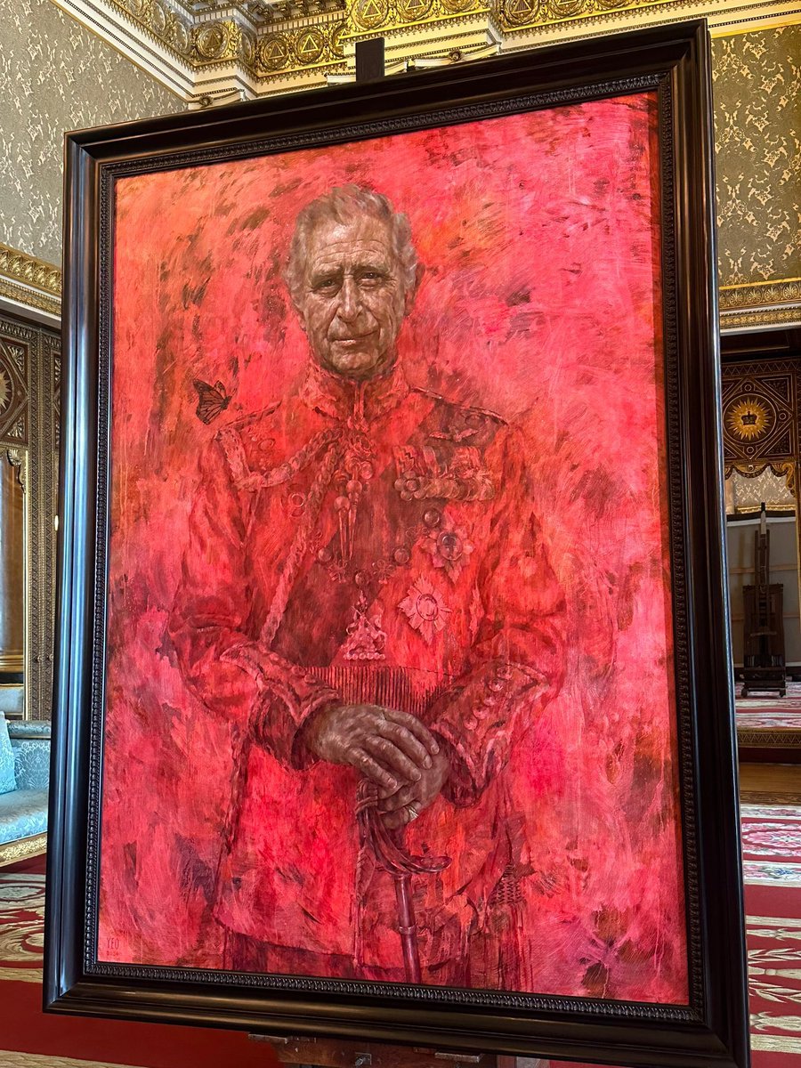 I dunno who recommended red on red to His Majesty King Charles- but this self portrait is odd at best. What is going on with the Royal Family?