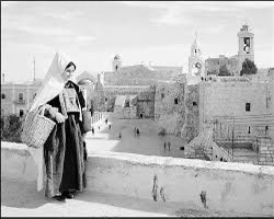 Palestine before 1948. A photo of a Palestinian woman walking near the Church of the Nativity in Bethlehem in the occupied West Bank.