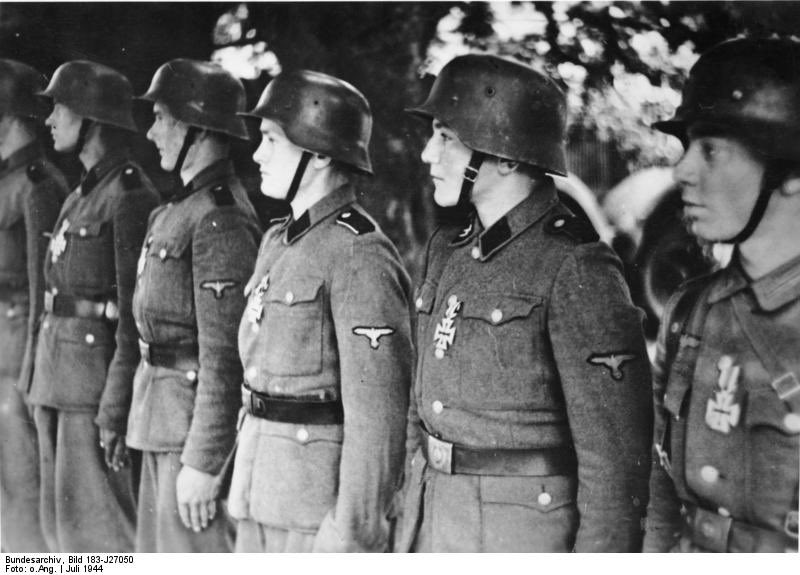 Panzer Grenadiers of German 12th SS Panzer Division 'Hitlerjugend' lined up during an Iron Cross awarding ceremony in July, 1944. #History #WWII