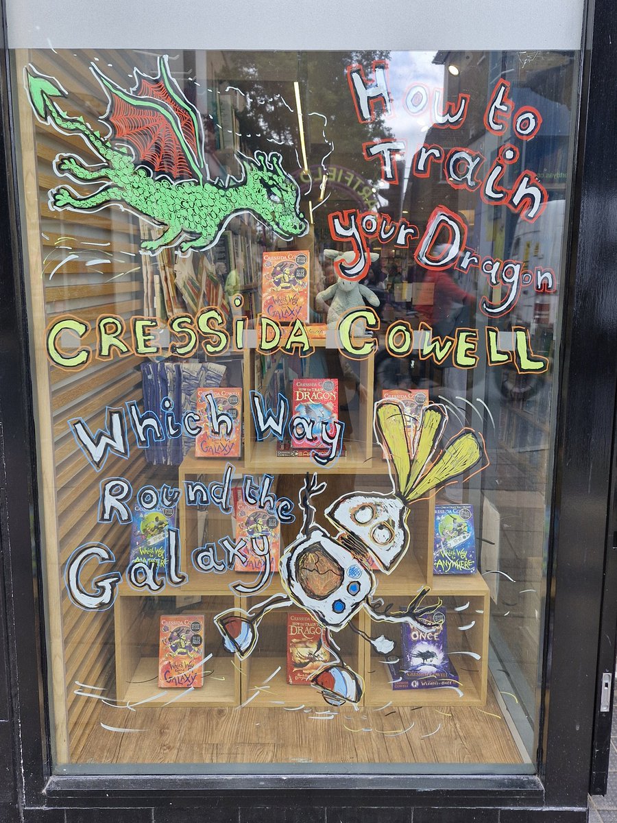 We were delighted to welcome @CressidaCowell to Wimblestones. Not only did she sign her fantastic books for our lucky customers, but look at the window illustration she did for us! Come by and have a look! #HowToTrainYourDragon #WhichWayRoundTheGalaxy @HachetteKids @HachetteUK