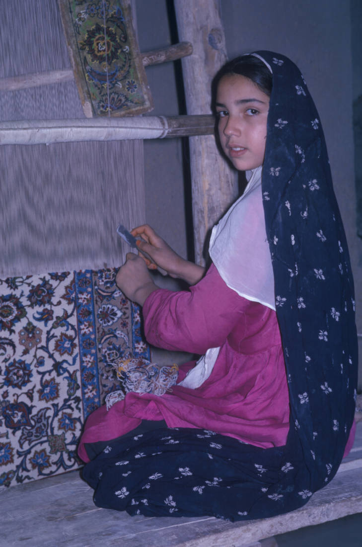 Persian girl weaving a rug, Isfahan, Iran, 1961.