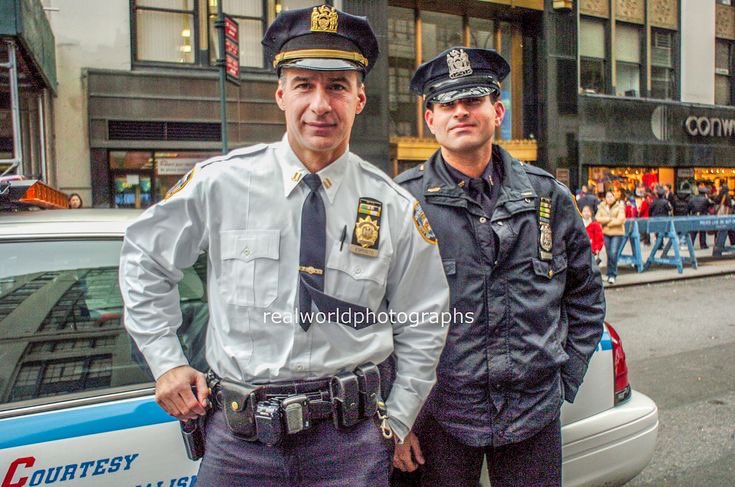 Two members of the NYPD in central New York City, USA. Gary Moore photo. Real World Photographs. #newyork #newyorkcity #cops #nypd #police #cities #usa #malmo #sweden #skane #photojournalism #streetphotography #realworldphotographs #photography #documentary #garymoorephotography