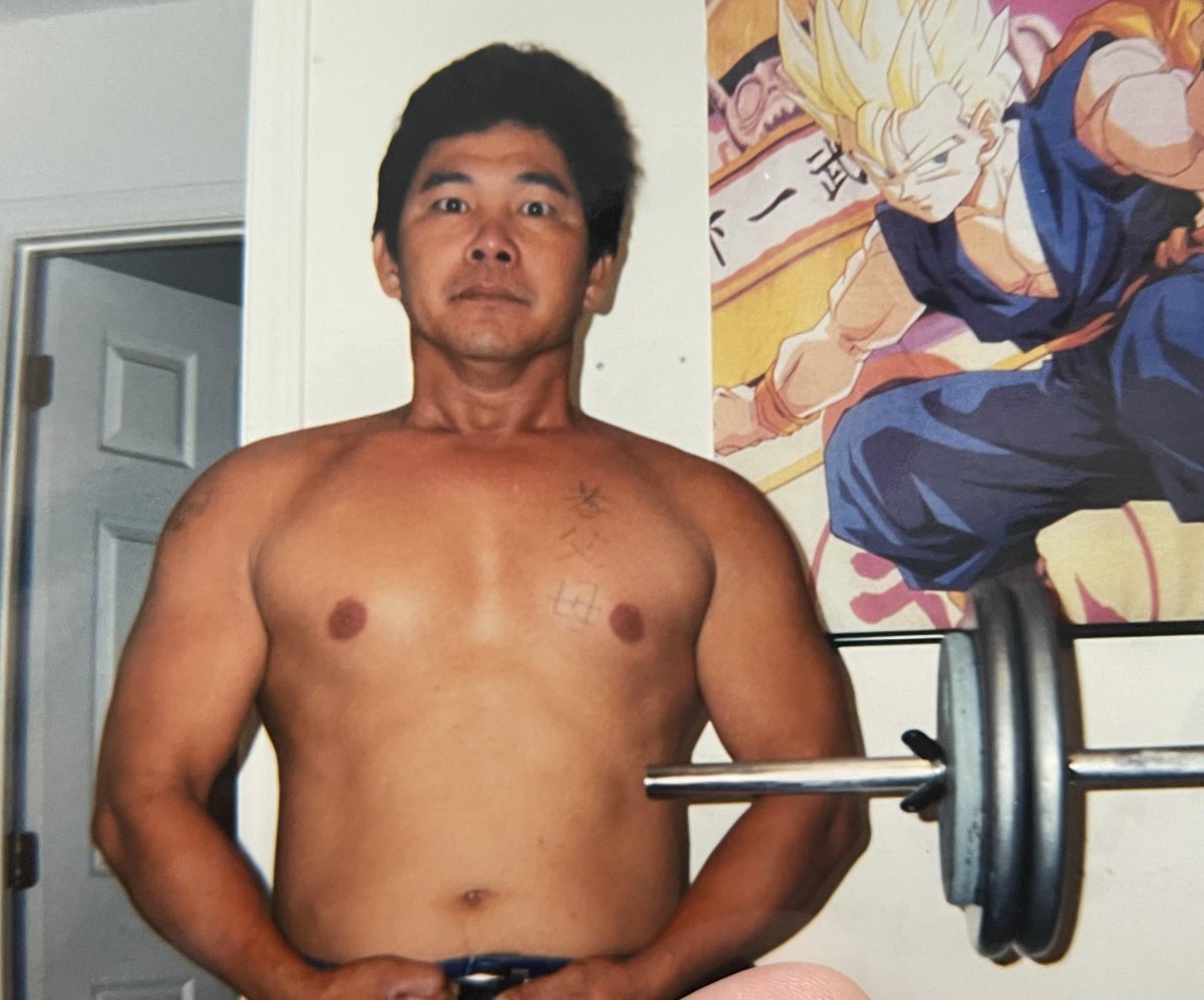Also hilarious my dad posing by a dbz poster back then