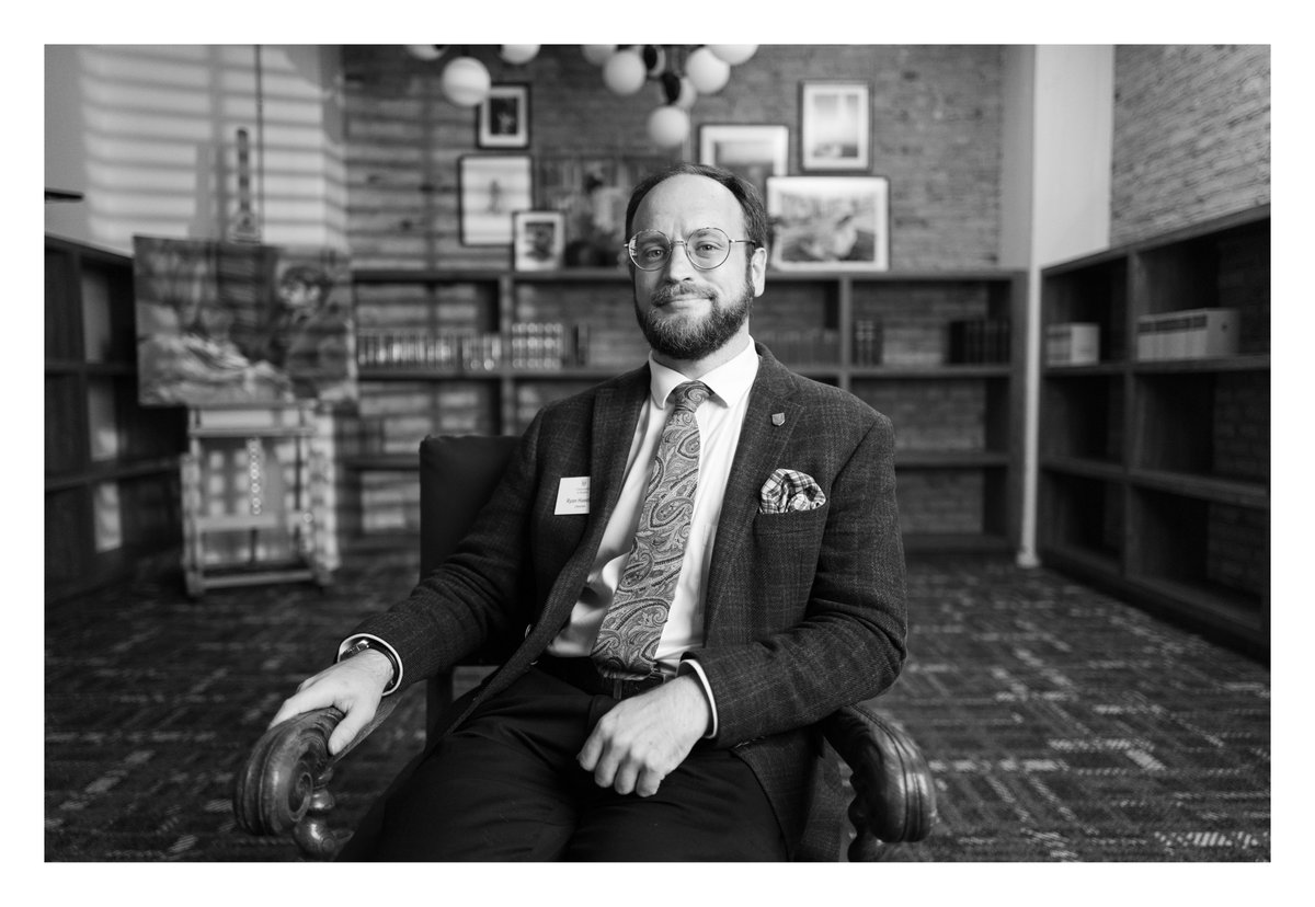 New staff portrait in the @uaustinorg library