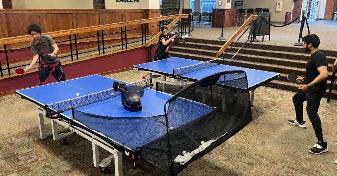 Members of the CSC Ping Pong Club practice in the Student Center with a new serving practice machine. 🏓🏓🏓 #CSCeagles #chadronstatecollege