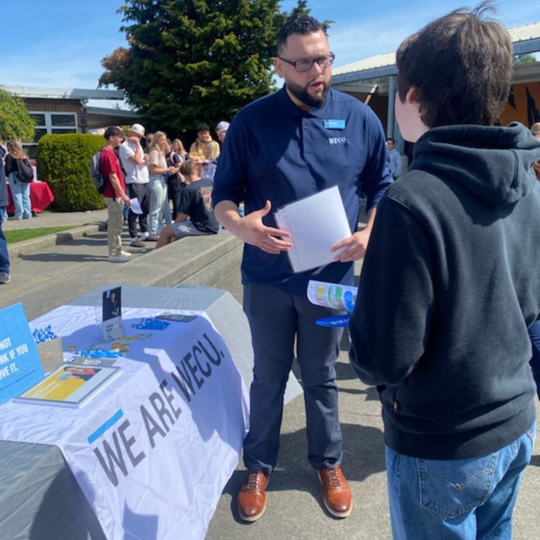 Today, WECU was at the Burlington-Edison High School career fair. Sunset Branch Assistant Manager Ernesto shared with students the benefits of being a WECU member, including member scholarships. Investing in education and communities we serve is core to who we are at WECU.