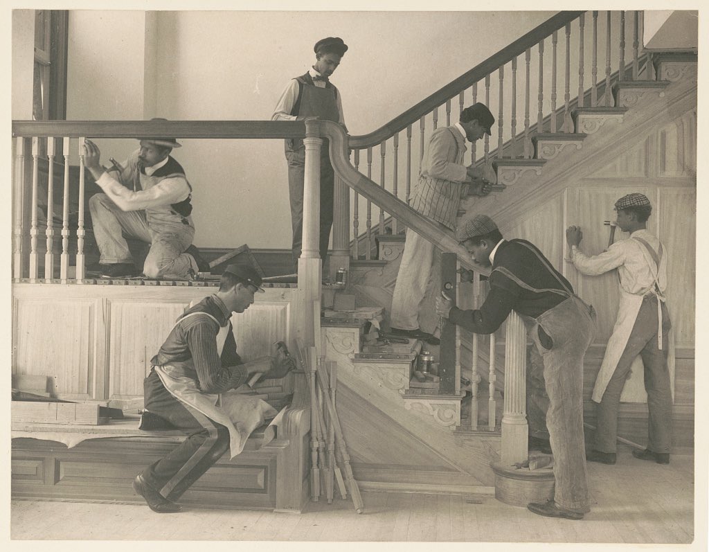 Black American woodworking students constructing the staircase of a home they built in Hampton (1899)