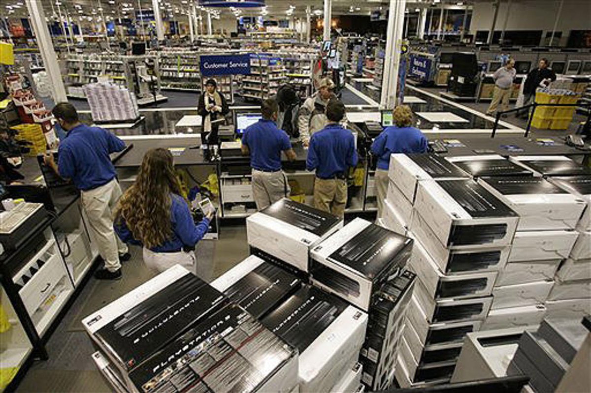 Huge stacks of PS3’s lay behind a Best Buy customer service counter ready to be sold on launch day. (2006)