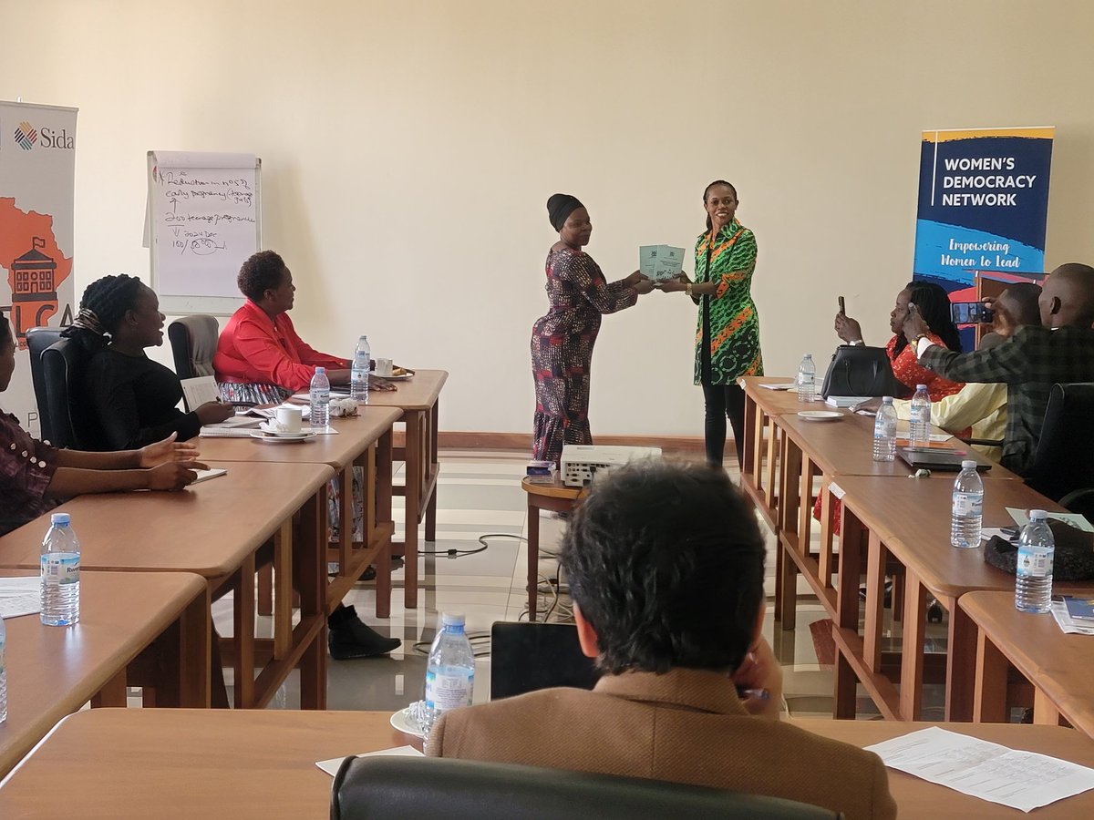 Some of the councilors receive copies of the Local Government Act and Standard Rules of Procedure of Council at the WDN-U&KIC training for women & youth councilors from 25 districts of Uganda @wdn