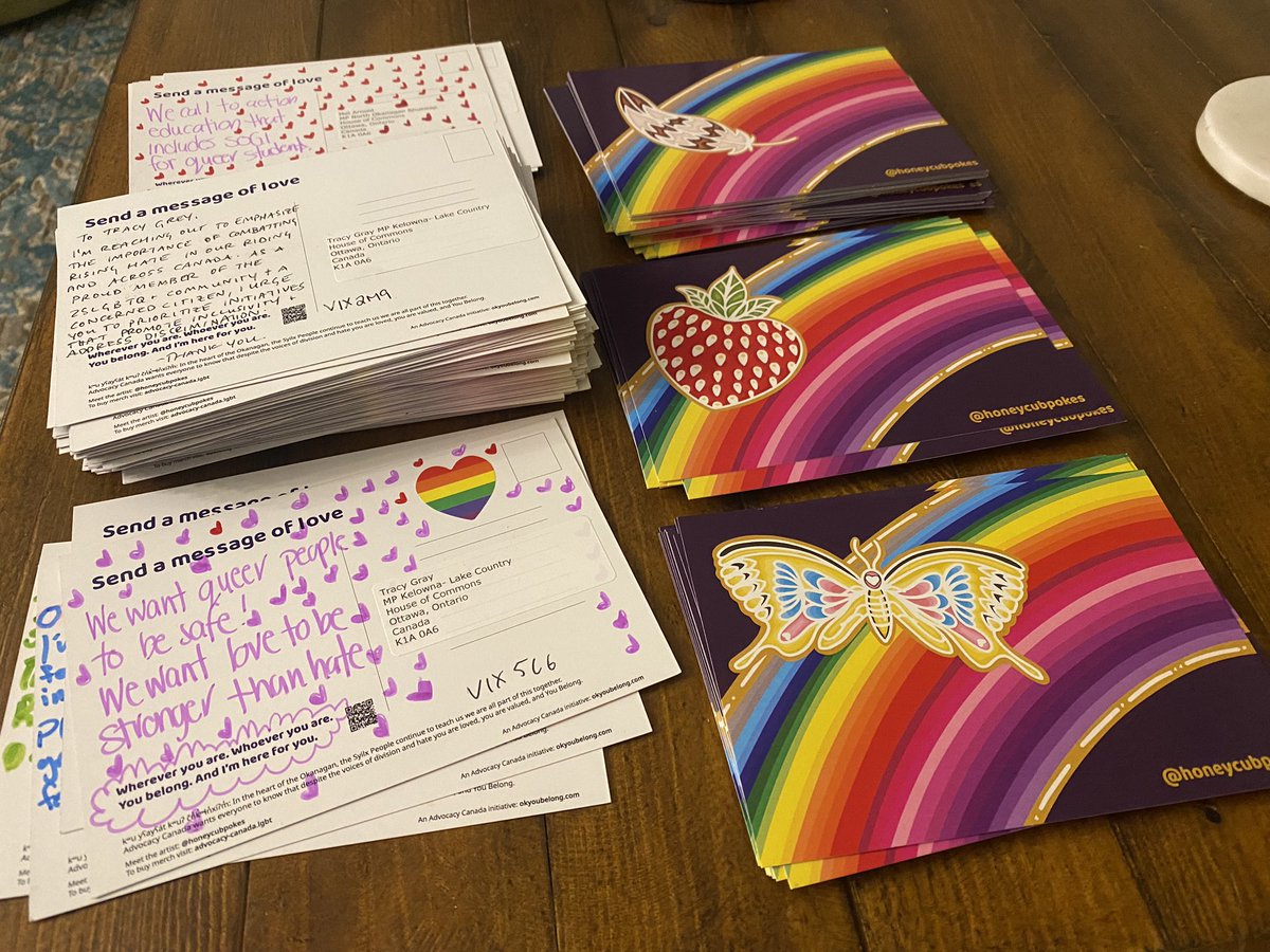Over 50 people gathered in Kelowna to write postcards to their MPs today for #RainbowEquality. I just counted 179 cards. The big stack of 99 is for <a href="/TracyGrayKLC/">Tracy Gray</a>. We used the beautiful You Belong postcards from @AdvocacyCanada1