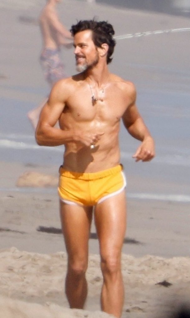 save me Matt Bomer running on a beach with a tight short save me