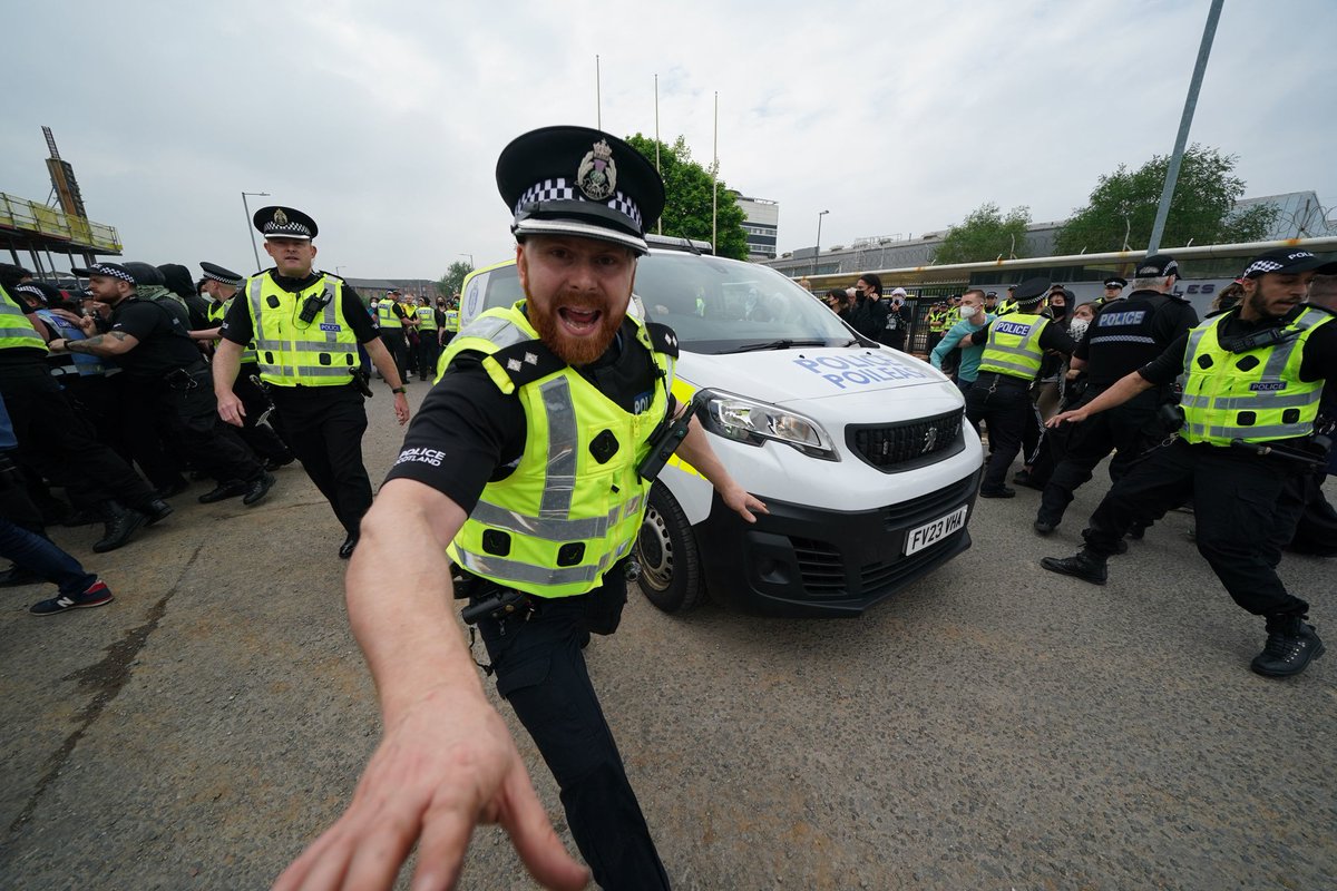 If you are this angry at a photographer taking photos of an official police action, perhaps you need to refocus your life and use that anger positively- against genocide?