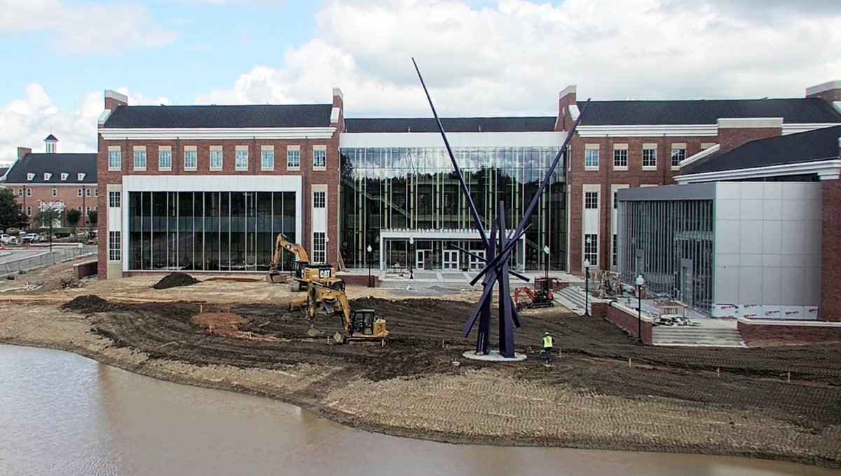The name is on the building and there's water in the pond! The Ashraf Islam Engineering Building has sidewalks poured on the Stadium Dr. side and sod will be in place soon. Stay up to day on the latest with the Denark Construction web cam app.oxblue.com/cameras/18570d… #watchusgrow 🤩