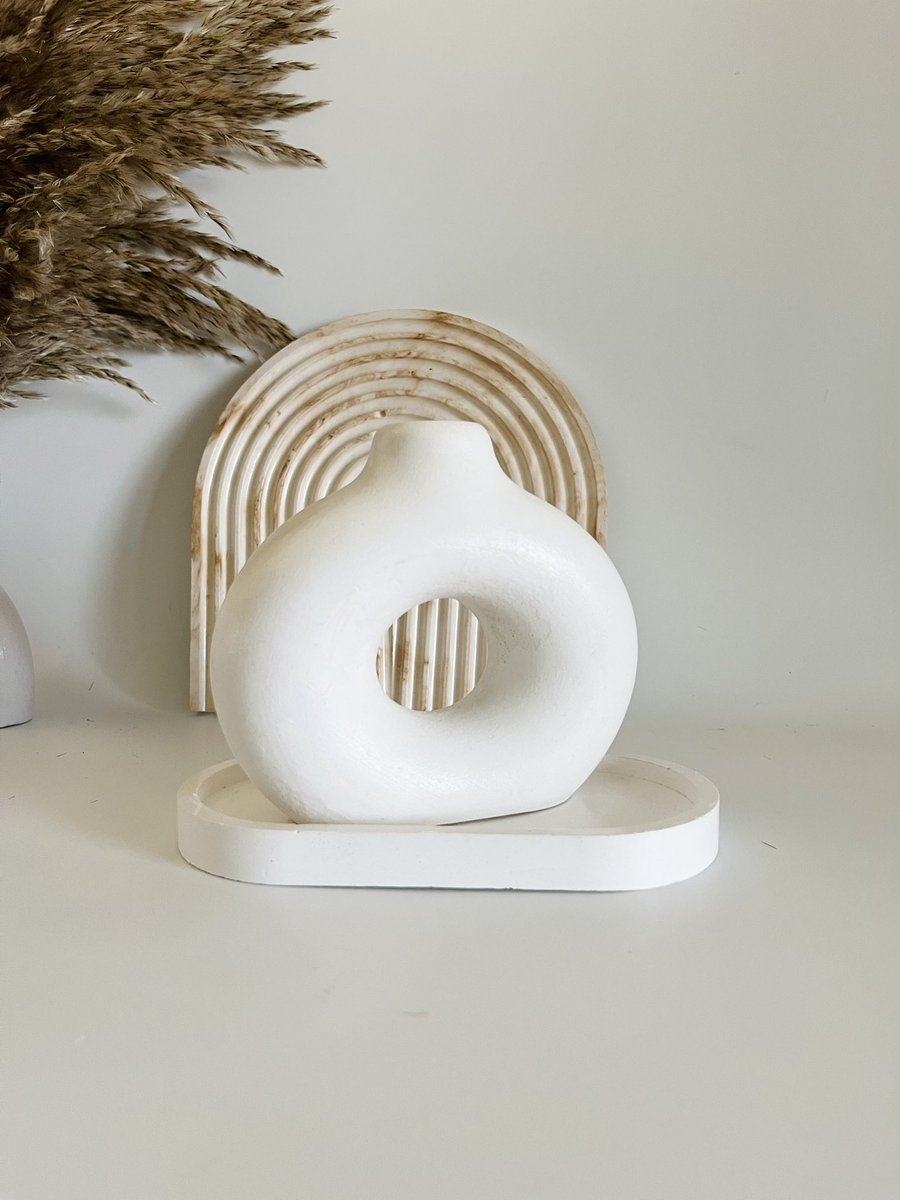 Handcrafted with love and eco-friendly materials, these beautiful vase and arch tray bring a touch of nature to your space

Each piece is available to order on our website (link in bio) 

Arch Tray: 8000
Donut Vase: 15000 
Small Oval Tray: 5000 

Aesthetic Home Accessories