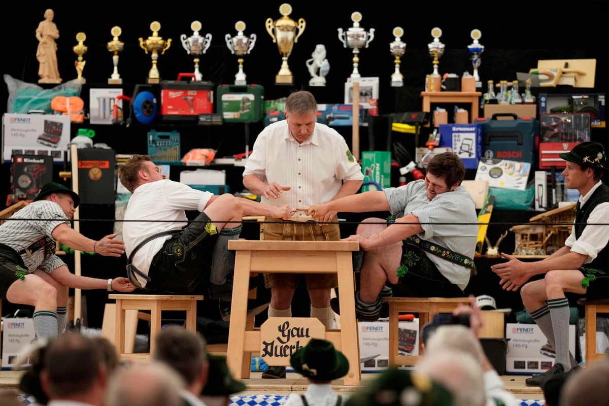 Oh, the humanity! A referee monitors competitors at the town’s finger-wrestling championships, at Bernbeuren, Germany