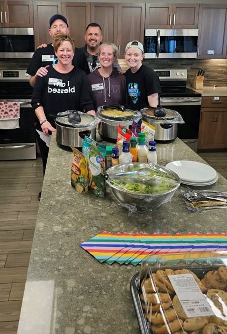Explorer Academy staff members spread cheer and helped provide food to families of patients receiving medical care and staying at the Ronald McDonald House of Red River Valley. Staff made spaghetti, chicken alfredo, garlic toast, salads, and cookies.