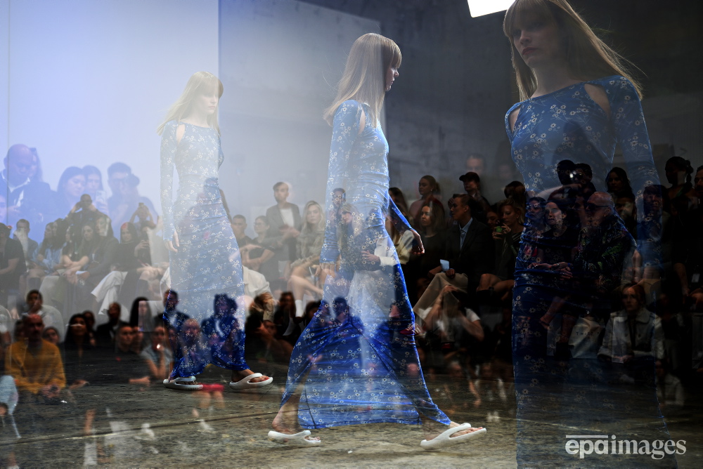 An in-camera triple exposure shows a model walk the runway during the Karla Spetic fashion show as part of Australian Fashion Week 2024 in Sydney, Australia, 15 May 2024. 📸 EPA / AAP / Bianca De Marchi