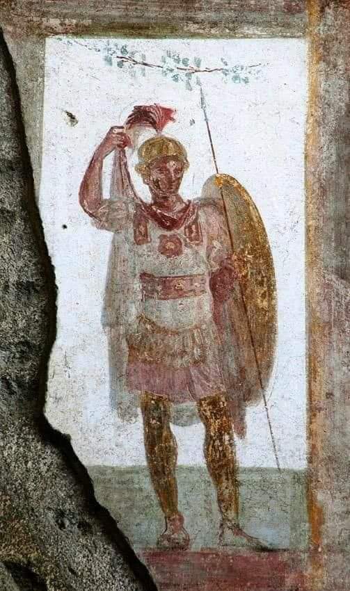 A fresco from the 'House of Valerius Rufus' in Pompeii. This is a perfect example of how we know what Replican Legionary troops looked like (this individual is probably from a wealthy family due to the extravagant nature of his panoply, and the 'Lorica Musculata' torso armour,