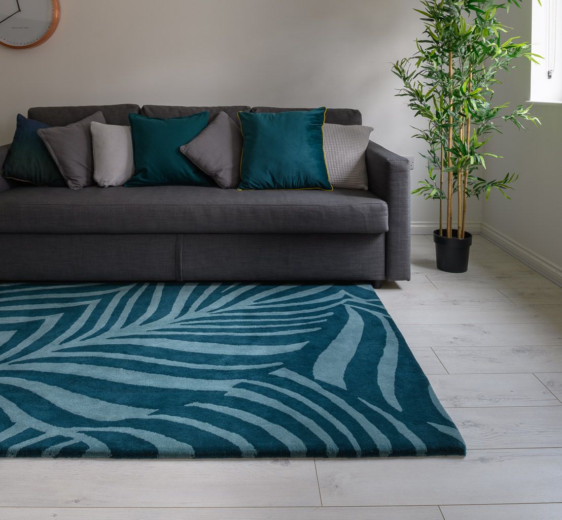 Our team of expert colourists have chosen deep turquoise and teal tones for this botanical 'Paradise' pattern to really bring the outside in. Find this and more within our stunning made to order hand tufted range of rugs.

#thewovenedge #customrugs #madetoorder #bespokeinteriors