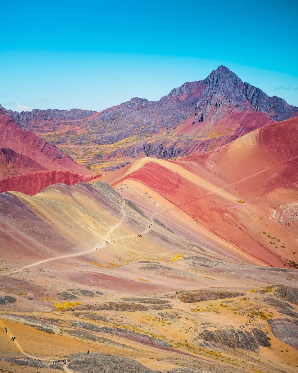 Rainbow Mountain, Peru 🌈 Also known as Vinicunca in Quechua (meaning 'colored mountain'), it lives up to its name with a dazzling display of 14 different minerals painting its slopes in vibrant hues of red, pink, yellow, turquoise, and more!