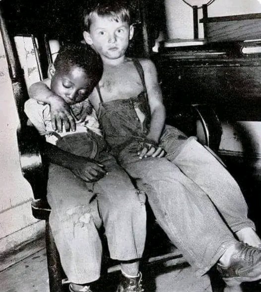 This is a picture from 1952 of two best friends in Chicago who got caught by the police at night. They used to sneak out at night to ride the L train. The boys were James Davis, age 5, who was black, and Ronald Sullivan, age 8, who was white. At the train station, James fell