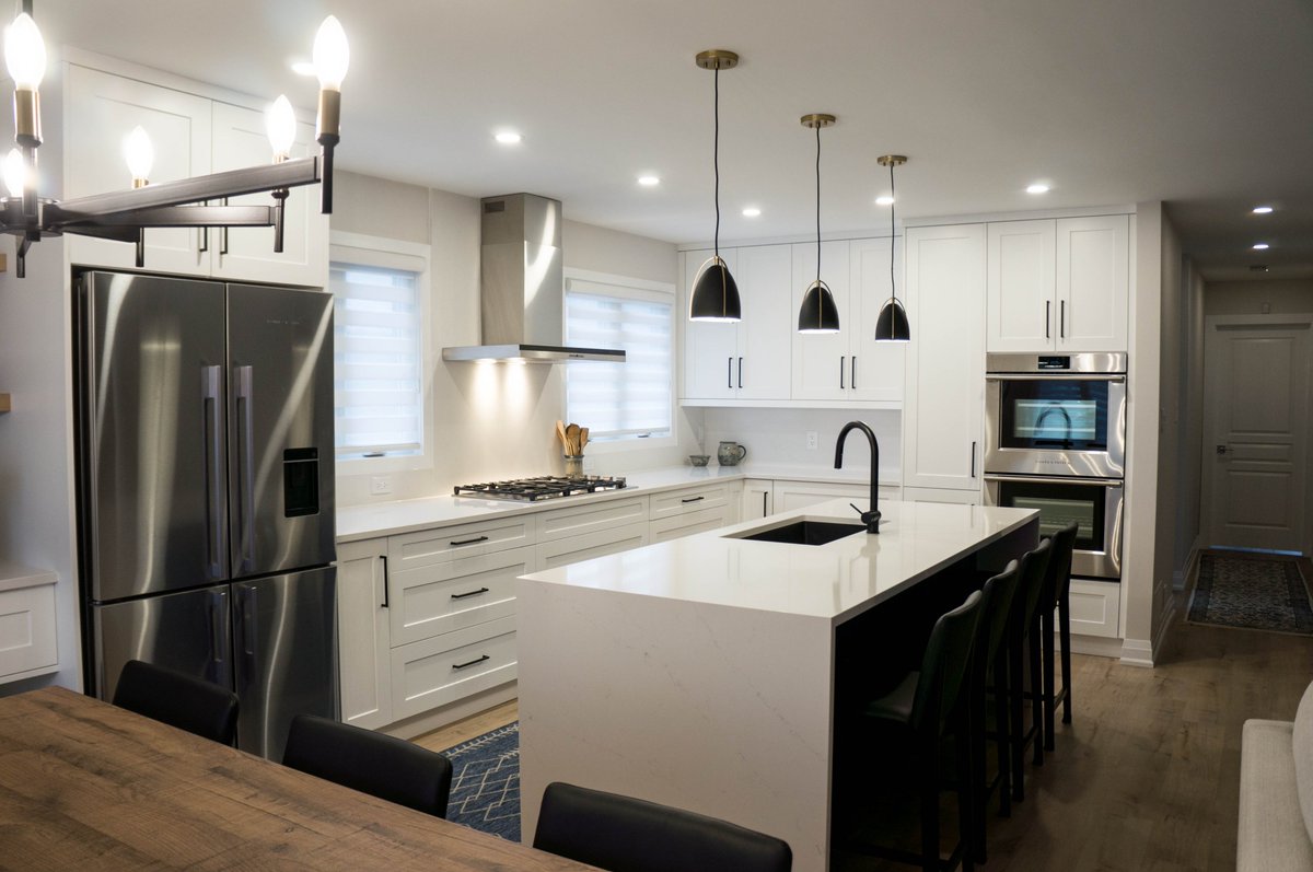 OakvilleKitchen's tweet photo. Our latest kitchen renovation in Oakville, where @Silestone quartz countertop with waterfall edges on the island, @decorcabinets Talora white and blue cabinetry and state-of-the-art @FisherPaykelUS  appliances harmonize to create the ultimate cooking and dining space. https://t.co/14py3cwHS2