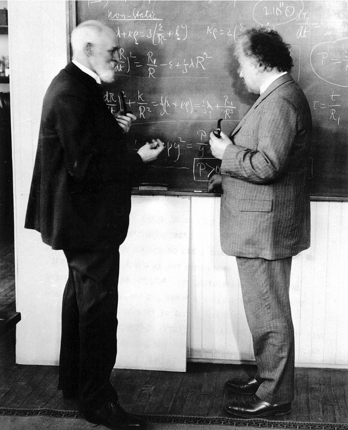 Willem de Sitter and Albert Einstein discussing equations that provide the best available language for describing the universe seen as a whole, on a Caltech blackboard, Pasadena, ca. 1932.