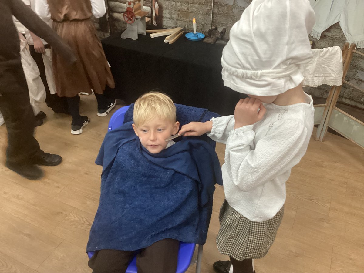 Some more of Year 2 experience chores from the past: cleaning the cutlery, washing clothes and shaving Victorian style!