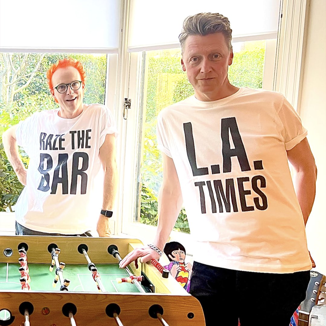 Fran and Dougie from @Travis came here to play foosball and look sexy in t-shirts... and they're all out of foosballs ⚽️ Get your Raze The Bar and L.A.Times tees exclusively from the Official Store! 👕 ↳ travis.tmstor.es