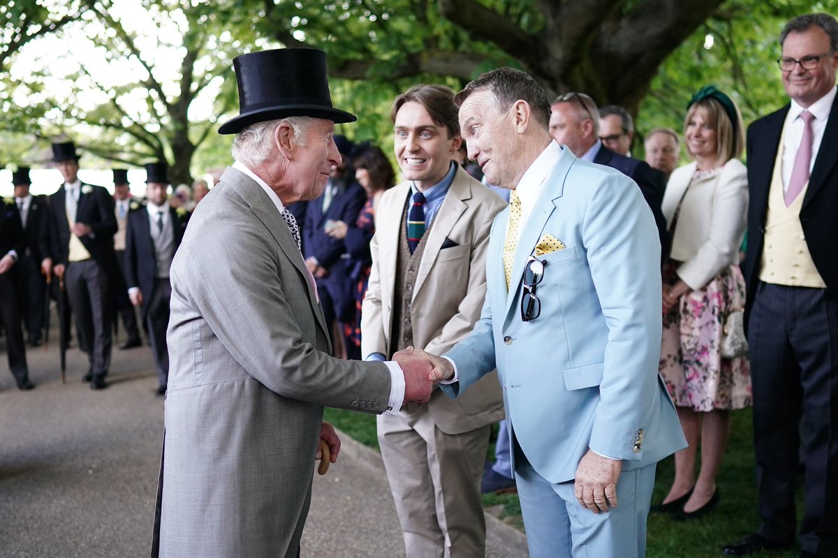 King Charles III and Queen Camilla greeting guests during the Sovereign's Creative Industries Garden Party at Buckingham Palace. In celebration of the Creative Industries. The Garden Party attended by representatives across culture, art, heritage, film, TV, radio and fashion.