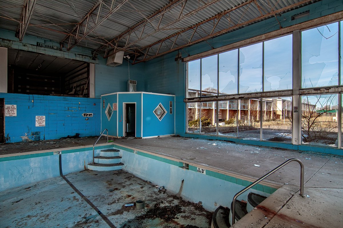 A long abandoned indoor pool inside a ravaged Michigan hotel.